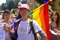 Young woman with rainbow flag at Pride Parade TA