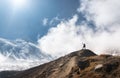 Young woman with raised up arms on the mountain peak Royalty Free Stock Photo