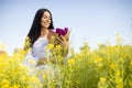 Young woman in the rapeseed field