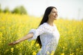 Young woman in the rapeseed field