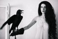 Young woman with raven