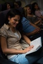 Young woman read book plane night flight Royalty Free Stock Photo