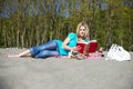 Young Woman Reading Book On Beach Royalty Free Stock Photo