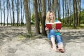 Young Woman Reading Book On Beach Royalty Free Stock Photo