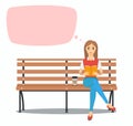 Young woman reading book on the bench.