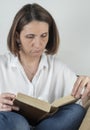 Young woman reading a book