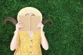 Young woman reading book on green grass, top view Royalty Free Stock Photo