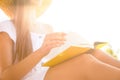 Young woman reading book outdoors, closeup Royalty Free Stock Photo