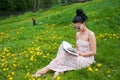 Young woman reading a book in the park Royalty Free Stock Photo