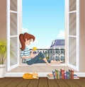 Young woman reading book in the window. Drinking tea and reading in the city. Royalty Free Stock Photo