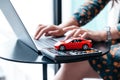 Young woman reading car loan contract, car trading at workshop Royalty Free Stock Photo