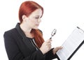 Young Woman Reading Document with Magnifying Glass Royalty Free Stock Photo