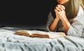Young woman reading the holy bible in morning. Royalty Free Stock Photo