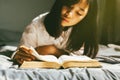 Young woman reading the holy bible in morning. Royalty Free Stock Photo