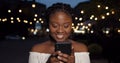 Young woman reading message and laughing. Royalty Free Stock Photo