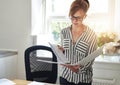 Young woman reading notes in an office binder Royalty Free Stock Photo