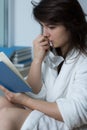 Young woman reading romance