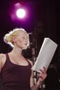 Young Woman Reading Script On Stage Royalty Free Stock Photo