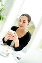 Young woman reading a text message Royalty Free Stock Photo