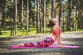 Young woman ready to practicing yoga in a forest. Upward Facing Dog Pose. Mind and body happiness concept Royalty Free Stock Photo