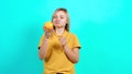 The young woman receives an orange and is happy.