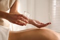 Young woman receiving back massage with oil in spa salon Royalty Free Stock Photo