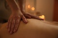 Young woman receiving back massage in spa, closeup Royalty Free Stock Photo