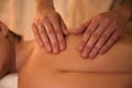 Young woman receiving back massage in spa salon, closeup Royalty Free Stock Photo