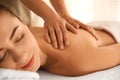 Young woman receiving back massage in spa salon Royalty Free Stock Photo