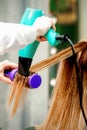 Young woman receiving drying hair Royalty Free Stock Photo