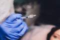 Young woman receiving a injection in her lips, close up. Royalty Free Stock Photo