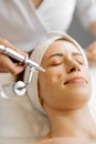 Woman receiving oxygen mesotherapy on her face,