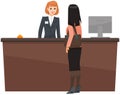 Young woman receptionist stands at reception desk. Girl booking, checking into hotel room