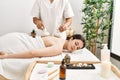 Young woman reciving herbal pouches thai massage at beauty center