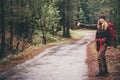 Young Woman with red backpack hitchhiking Royalty Free Stock Photo