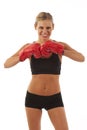 Young woman with red boxing gloves Royalty Free Stock Photo