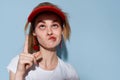 young woman in red cap summer fashion posing isolated background Royalty Free Stock Photo