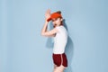 young woman in red cap summer fashion posing isolated background Royalty Free Stock Photo