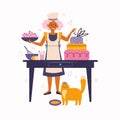 Young woman with a red cat cooks in the kitchen. The pastry chef decorates the cake with cherry berries. Spending time at home. Royalty Free Stock Photo