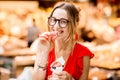 Spanish woman eating jamon at the market Royalty Free Stock Photo