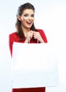 Young woman in red dress holding white shopping bag with copy s Royalty Free Stock Photo