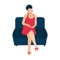 A young woman in a red dress is sitting on the sofa Royalty Free Stock Photo