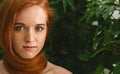 Young woman with red hair around neck as scarf Royalty Free Stock Photo