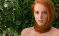 Young woman with red hair around neck as scarf Royalty Free Stock Photo