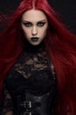 Young woman with red hair in black gothic costume Royalty Free Stock Photo