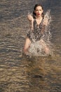 Young woman with red lips in water. Royalty Free Stock Photo