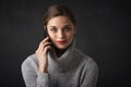 Young woman with red lipstick using her mobile phone Royalty Free Stock Photo