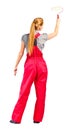 Young woman in red overalls with painting tools Royalty Free Stock Photo