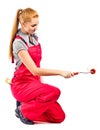 Young woman in red overalls with painting tools Royalty Free Stock Photo