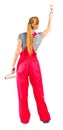 Young woman in red overalls with painting tools Royalty Free Stock Photo